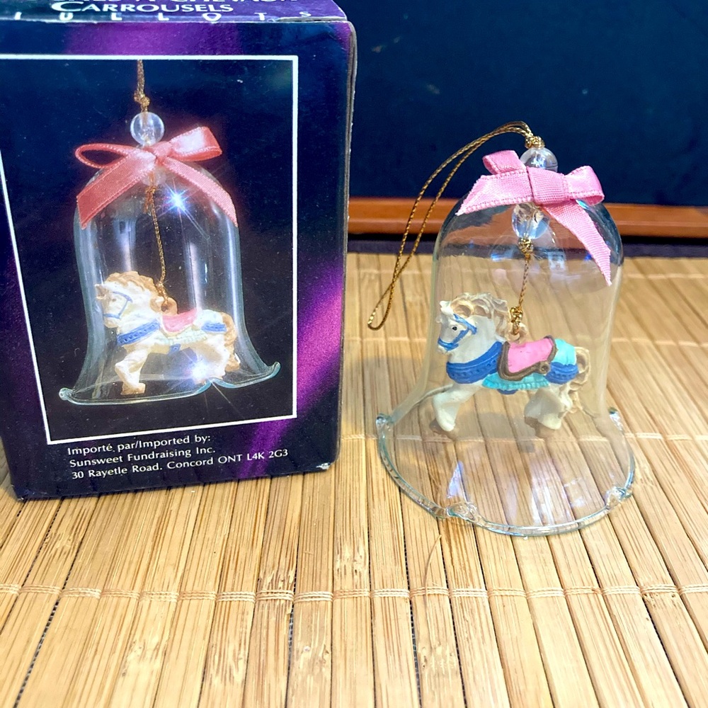Handpainted carrousel porcelain horse in a sparkling crystal bell ornament